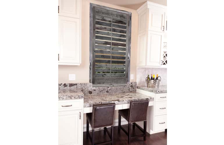 Kitchen window with reclaimed wood shutters in Philadelphia